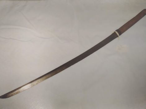 A photograph of a curved sword