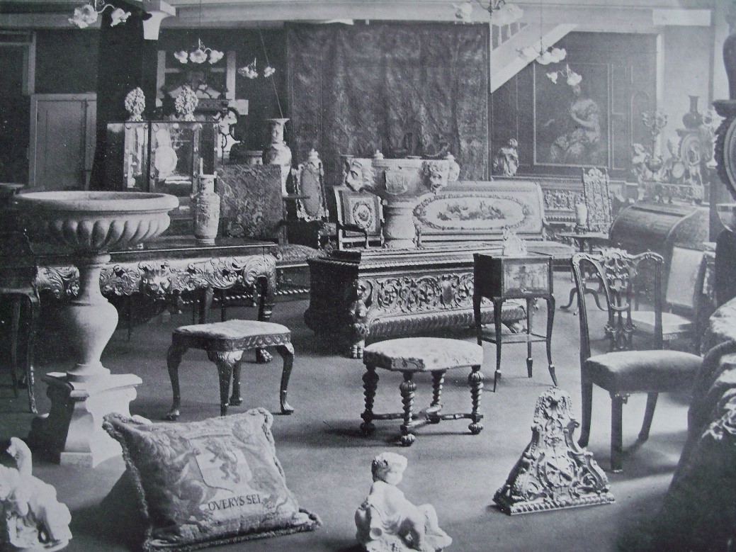A black and white image of an antiques sale