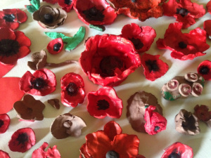 Clay poppies made by Inkwell Arts and Groundwork Leeds