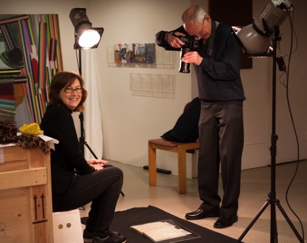 Jane Speller and Norman Taylor photographing items from the Kitson archive, in what looks like a studio.