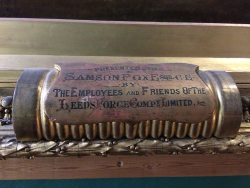 a sign on a flue that says 'presented to samson fox by the employees and friends of the leeds forge company limited