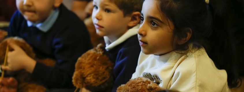 Children holding teddy bears