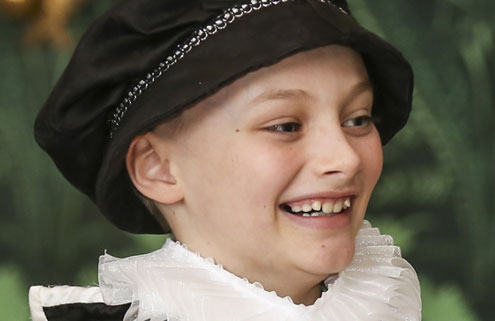 A young boy in Tudor costume