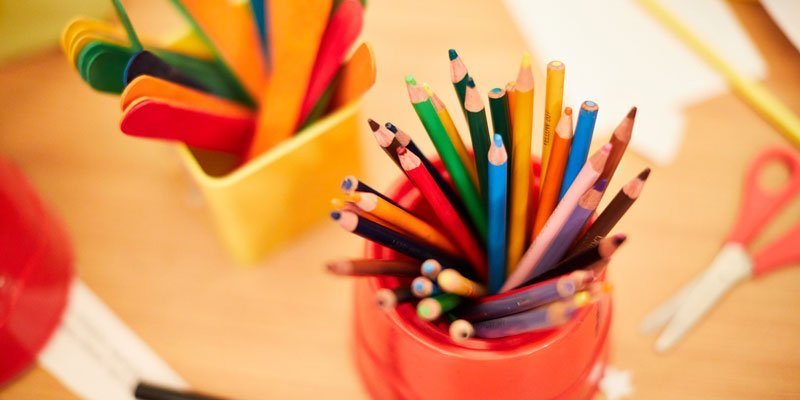 Coloured pencils and other craft materials set-up for school activities
