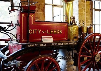 Victorian era steam powered vehicle with 'City of Leeds' printed on the side