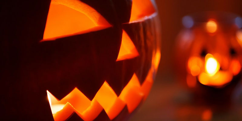 Traditional pumpkins carved with scary faces for Halloween