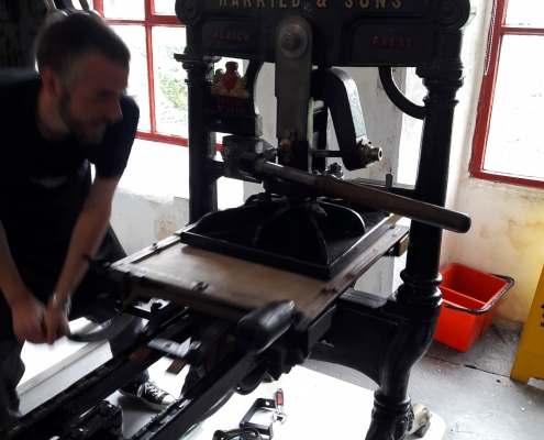 Printing labels on the original Albion printing press in our collection