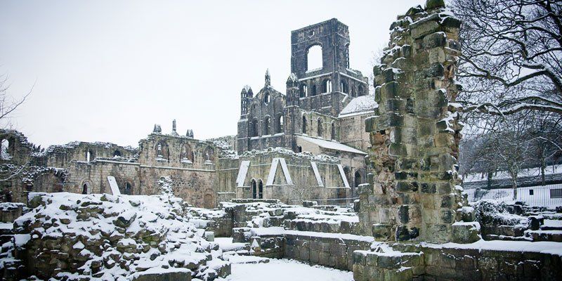 Kirkstall Abbey ruins covered in snow