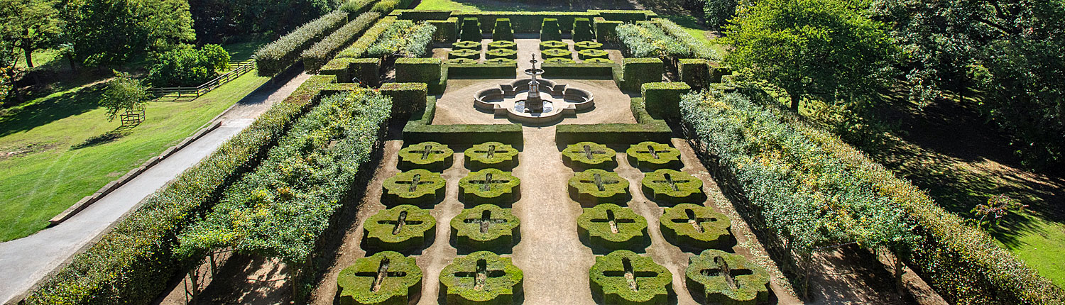a photo from above showing the formal gardens of Temple Newsam including trees, grass and manicured bushes