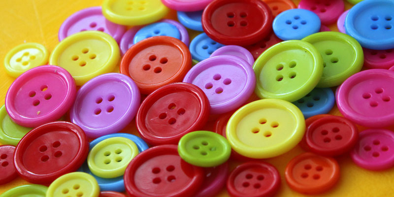A pile of assorted coloured buttons