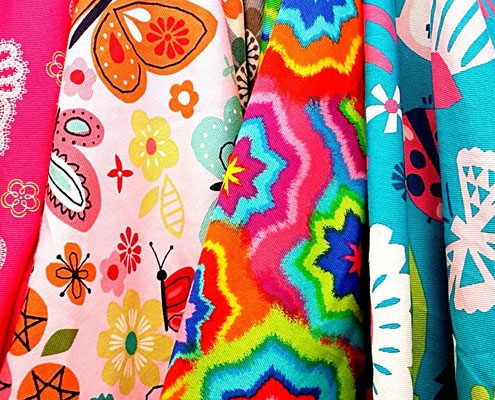 Lots of brightly coloured fabrics layered together
