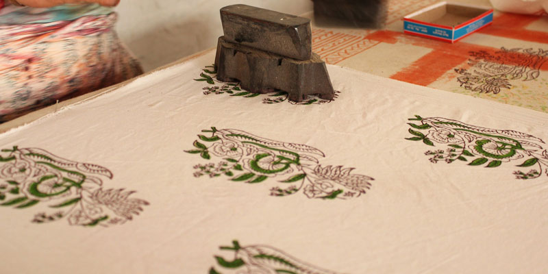 old printing object printing green patterns on to cloth