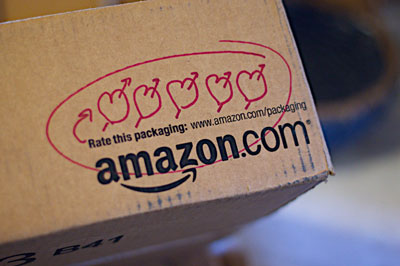 An amazon box with hearts drawn on in red pen.
