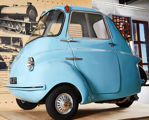 A blue scootacar modelled in Hunslet in the 1950s on display in a museum