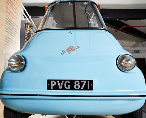 A blue scootacar modelled in Hunslet in the 1950s on display in a museum