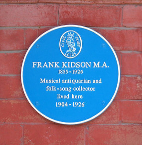A photograph of a blue plaque, showing that Frank Kidson lived in that house.