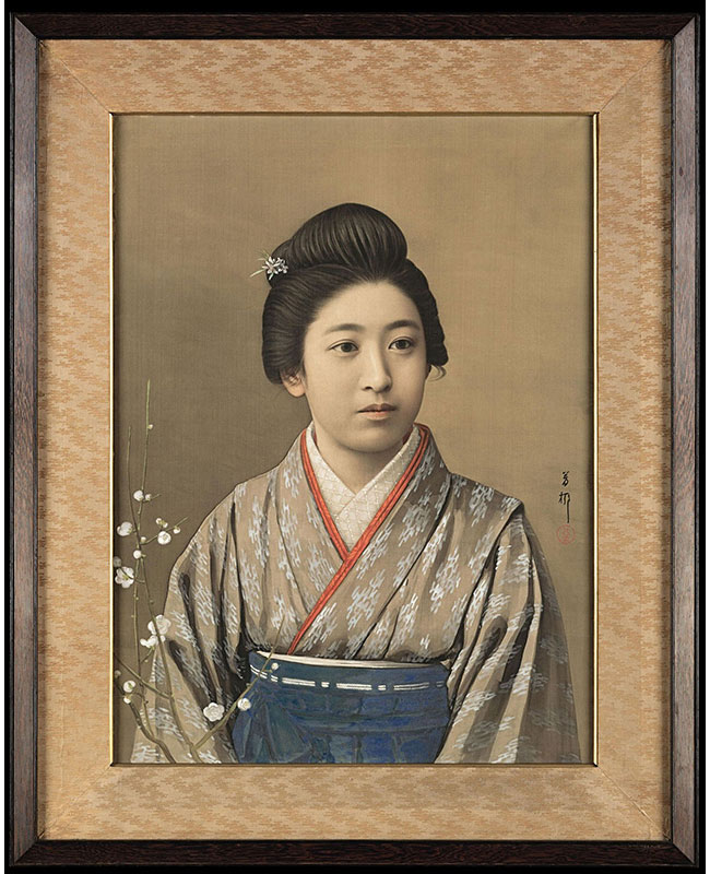 Painting on silk in mineral pigments, sumi ink and gofun or clam shell gesso mounted as a gaku or framed panel, depicting a beautiful young woman dressed in kimono and hakama with a branch of flowering white plum. Signed on the right side: Horyu, and sealed (Goseda Horyu II, the go or art name of Goseda Yoshio, 1864 – 1943). In the original period frame of East Indian rosewood and beveled silk brocade. Meiji Era, circa 1893 – 1912.