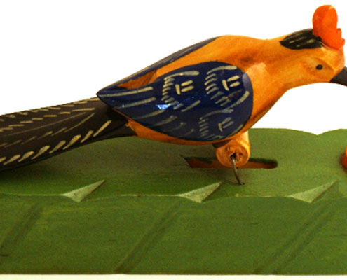 A brightly coloured wooden bird toy