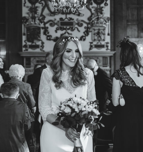 Louise Barry - A bride walks happily down the isle in Temple Newsam House