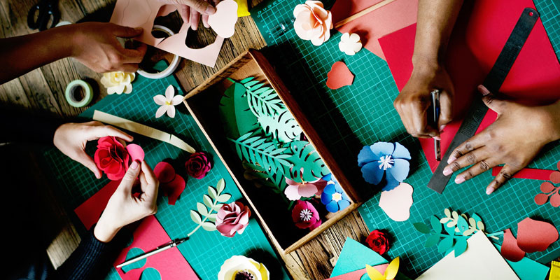 A craft session making card flowers