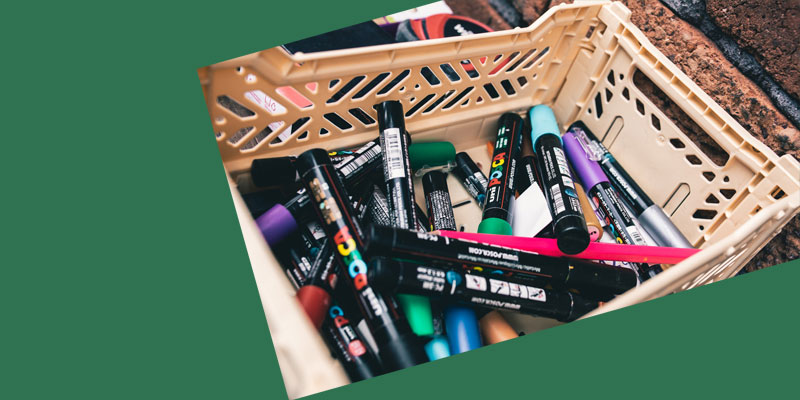Multi coloured pens in a basket