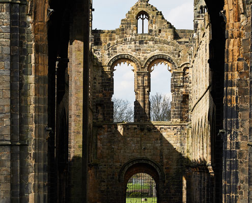 A view from the rear of the church through the large window of Kirkstall Abbey