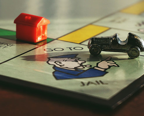 Monopoly board game close up of the 'Go to jail' square.