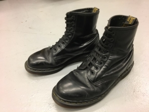 A pair of black Dr Marten boots