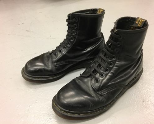 A pair of black Dr Marten boots