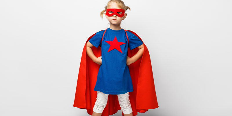 A girl dressed as a superhero