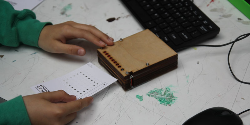 A child producing a pattern using Pattercraft coding