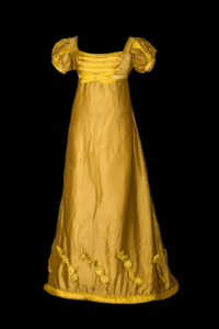 A yellow silk ball gown with short puffed sleeves