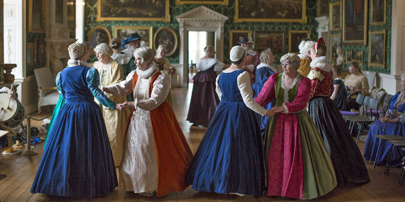Dancers in Tudor costume perform inside the Picture Gallery of Temple Newsam House
