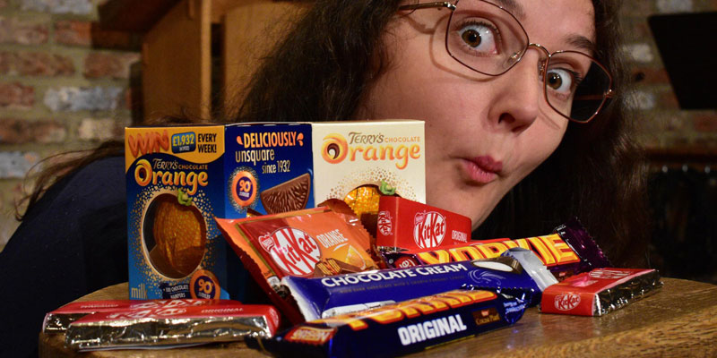 A woman with chocolate bars in front of her