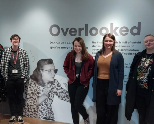 Members of the Preservative Party at the entrance to the Overlooked exhibition at Leeds City Museum