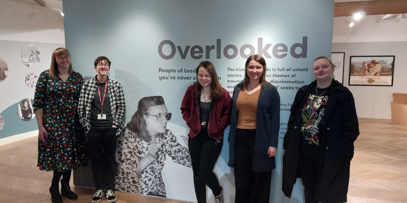 Members of the Preservative Party at the entrance to the Overlooked exhibition at Leeds City Museum