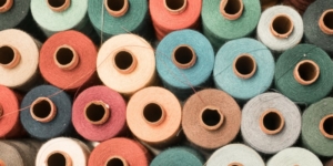 Lots of cotton reels of different colours