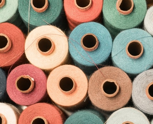 Lots of cotton reels of different colours