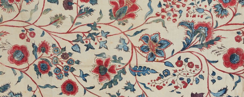 White fabric with a red and blue floral pattern
