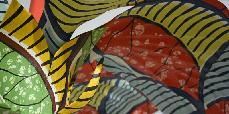 Close up of the maquette for Hibiscus Rising, a colourful 3d flower artwork
