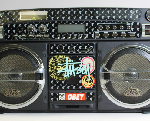 A boombox with stickers on