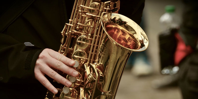 Close up of a person playing a saxophone