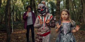 Two children dressed for Halloween in the woodlands of Lotherton