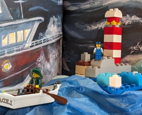 lego lighthouse, lighthouse keeper, and person rowing a boat