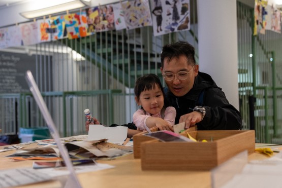 a man and young girl doing arts and crafts activities in artspace