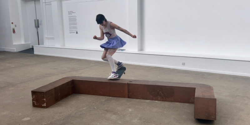 a person skateboarding on a sculpture