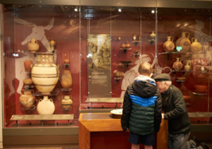 Two visitors in the Ancient Worlds gallery at Leeds City Museum.