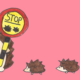 Illustration of a hedgehog with a lollipop sign that says "stop", with baby hedgehogs following behind.