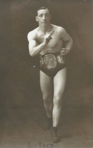 A man wearing a boxing belt