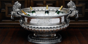 Lord Raby's Silver Wine Cooler with champagne in ice.